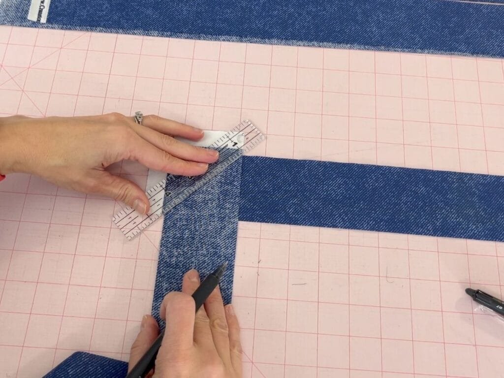 Joining binding strips for a table runner with right sides together.