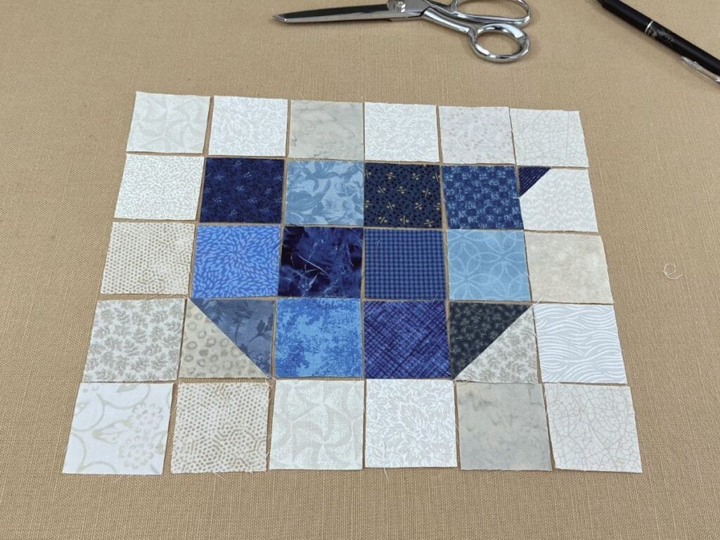 chicken quilt block laid out before sewing it together