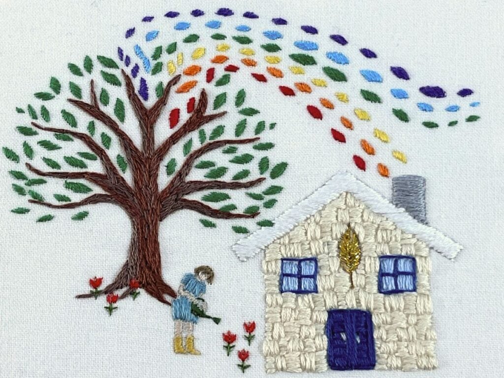 finished embroidery design with rainbow tree