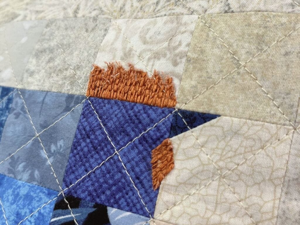 comb and wattle embroidery details