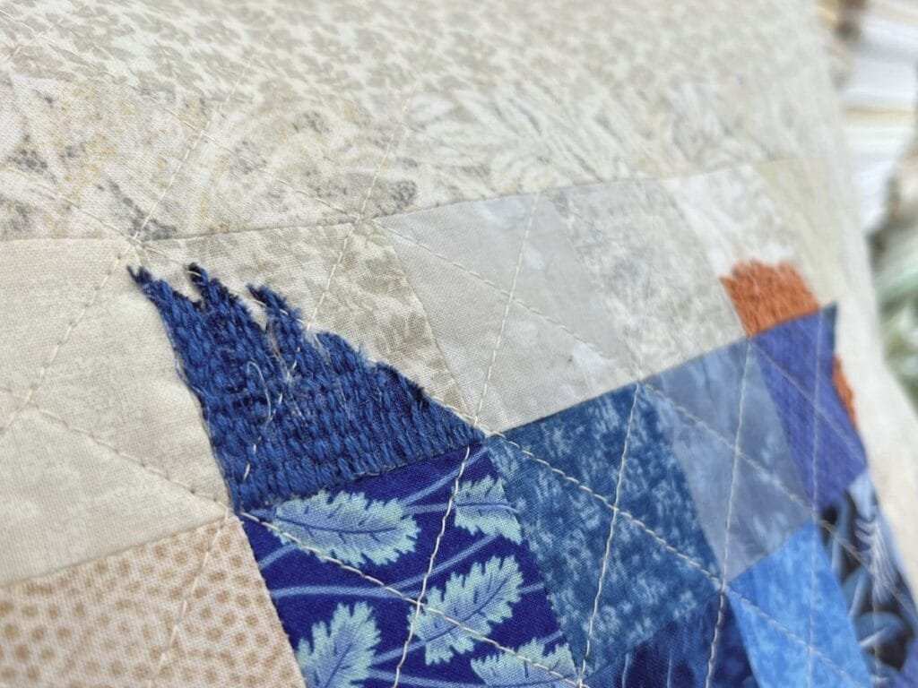 close up of embroidery on the chicken tail
