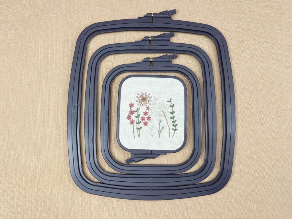 Set of 4 gray plastic rectangular (square) Nurge hand embroidery hoops.