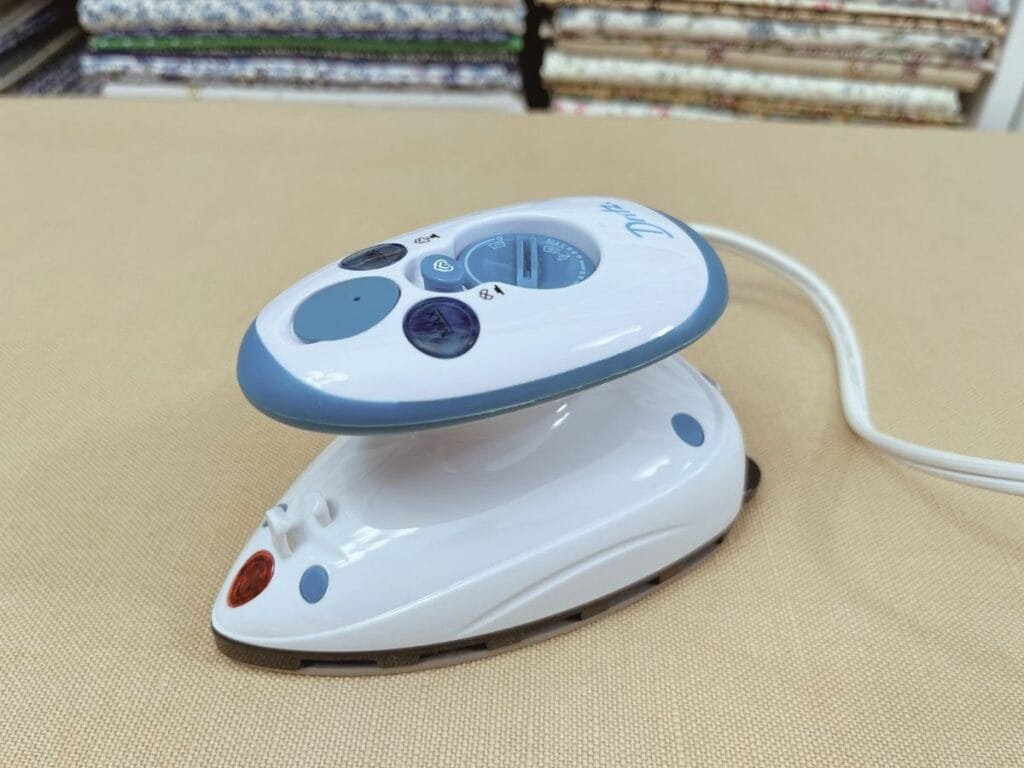 Mini Dritz iron on my pressing board. 