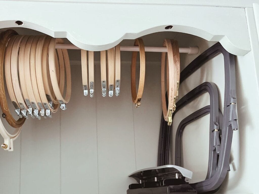 Embroidery hoops displayed on a tension rod in my hutch.