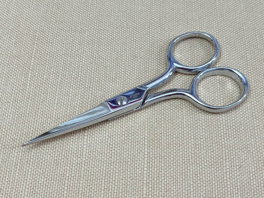 High quality Gingher scissors resting on my ironing board.